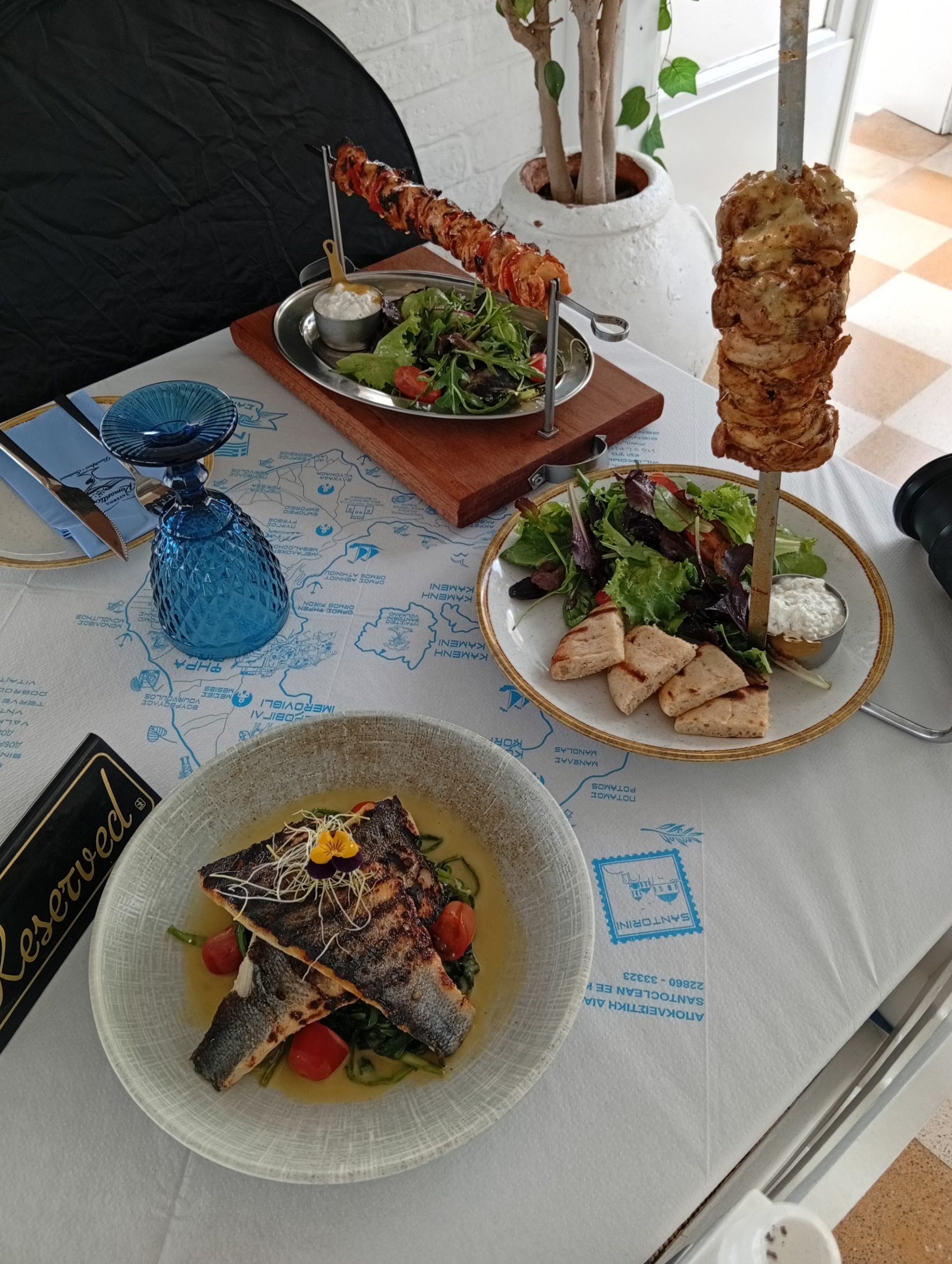 Authentic Greek food table at Taverna Romantica in Firostefani